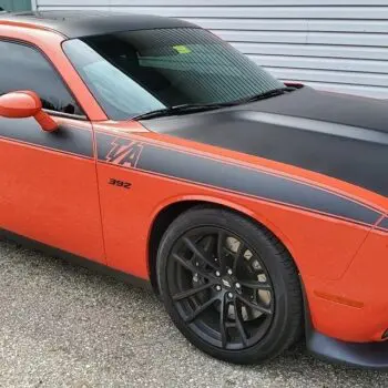 Orange muscle car with tinted windows