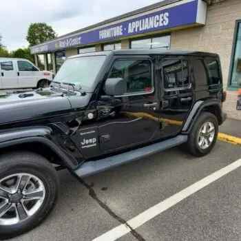 Black Jeep with tinted windows