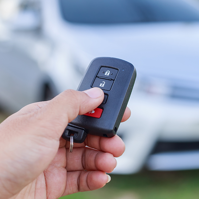 Person holding car key fob